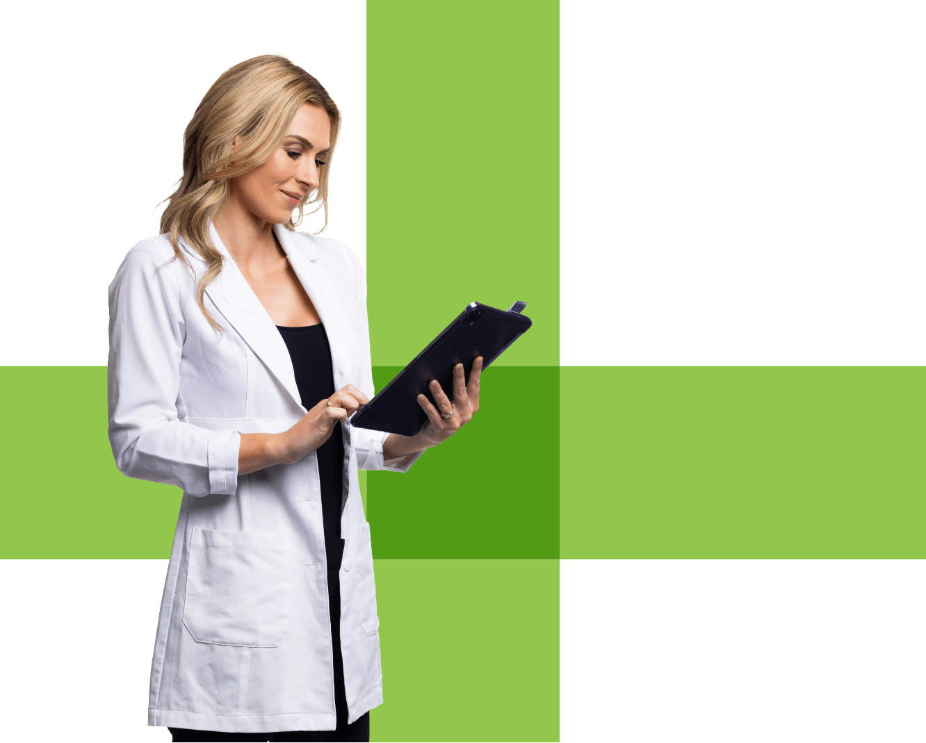 Visual of a female pharmacist in a lab coat looking at a tablet